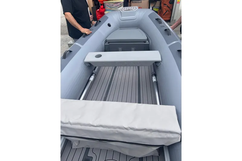 Slide: The Image of Inflatable boat interior, Hunter 466 model, 2002, with seating and storage compartments. - 57