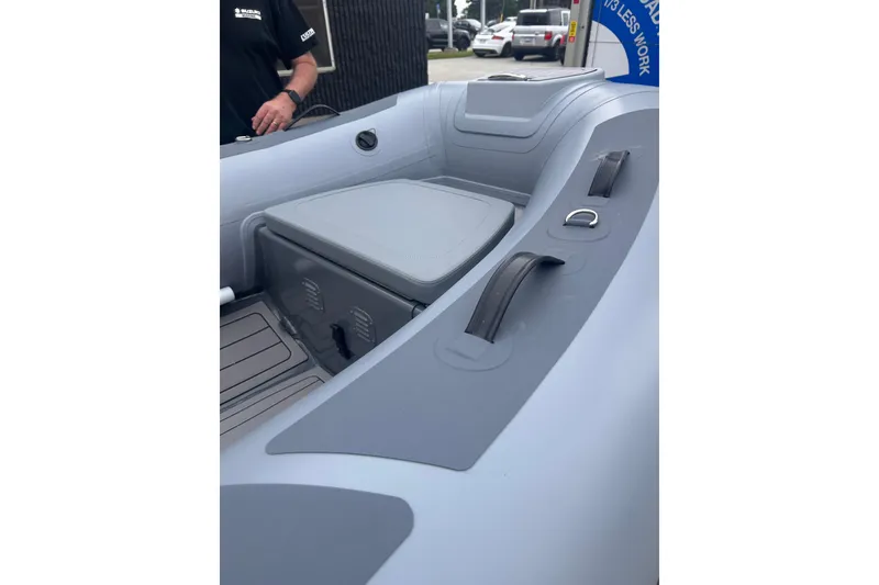 Slide: The Image of Inflatable boat interior, Hunter 466 model, 2002, featuring seating and storage compartments. - 58
