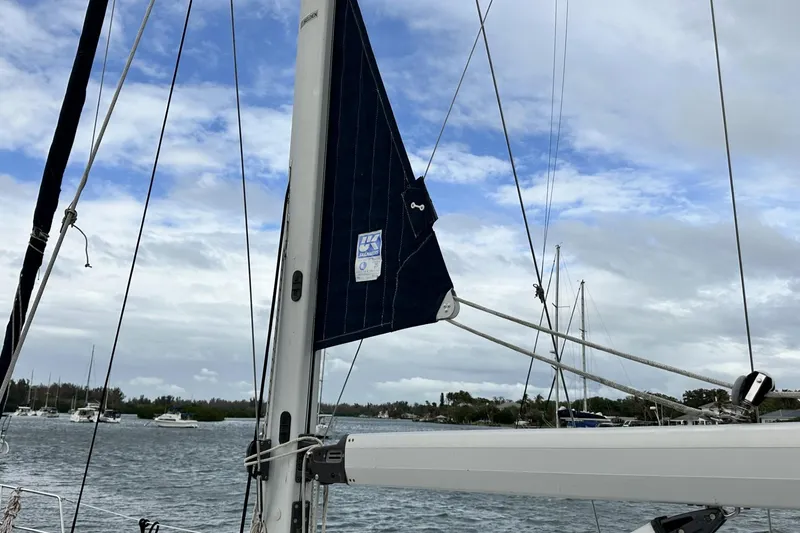 Slide: The Image of Sailboat mast and rigging on a 2002 Hunter 466 under cloudy skies. - 7