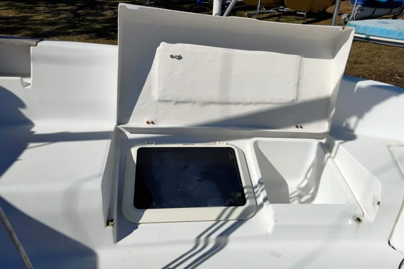 Slide: The Image of Open hatch on 1998 Hunter 240 sailboat deck, showing storage compartment. - 25