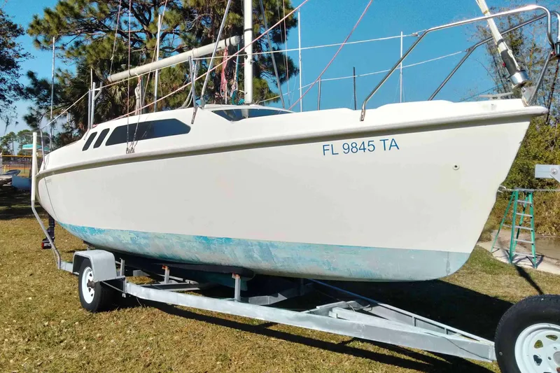Slide: The Image of 1998 Hunter 240 sailboat on trailer, parked on grass, with registration number FL 9845 TA. - 29