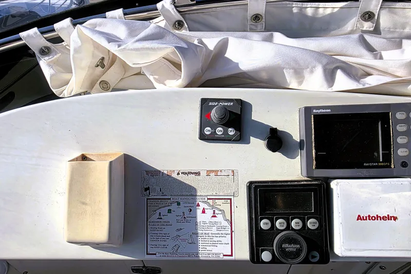 Slide: The Image of Control panel of a 1990 Californian 48 Cockpit Motor Yacht with navigation equipment. - 11