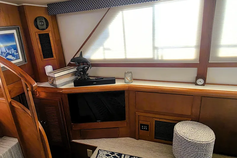 Slide: The Image of Interior of 1990 Californian 48 Cockpit Motor Yacht with wooden accents and decor. - 15