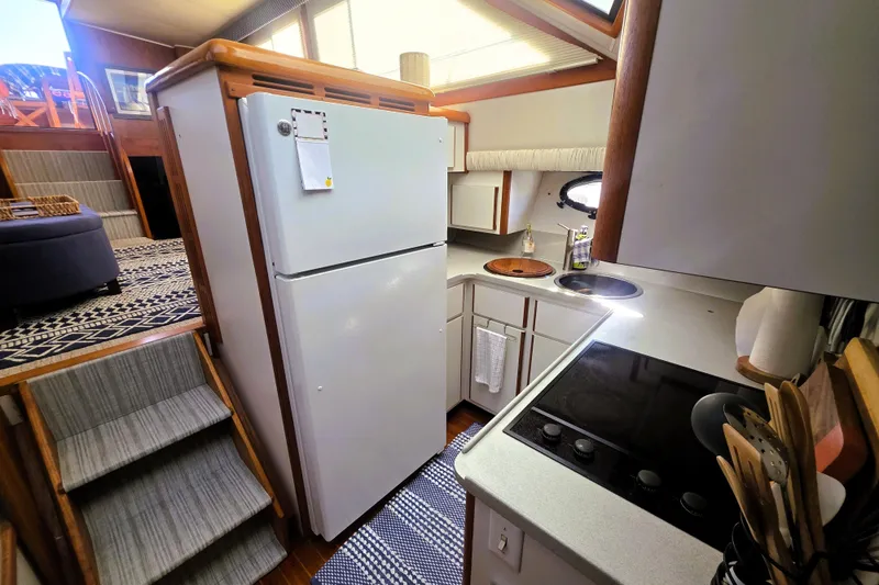 Slide: The Image of 1990 Californian 48 Cockpit Motor Yacht kitchen with modern appliances and cozy design. - 21