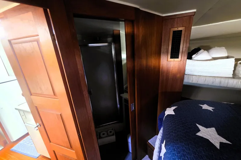 Slide: The Image of Interior of 1990 Californian 48 Cockpit Motor Yacht with cozy cabin and wooden finishes. - 25