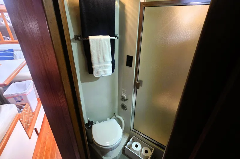Slide: The Image of Bathroom interior of 1990 Californian 48 Cockpit Motor Yacht with shower and toilet. - 27