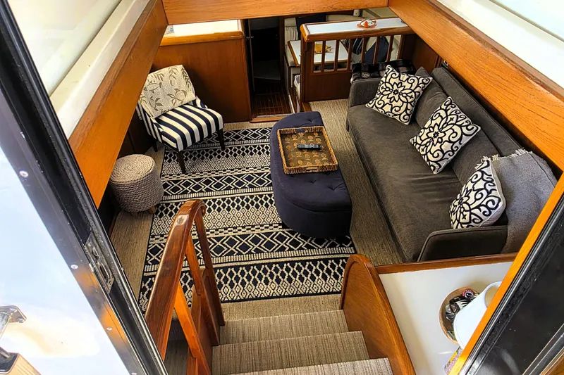 Slide: The Image of Interior of 1990 Californian 48 Cockpit Motor Yacht with cozy seating and decorative pillows. - 3