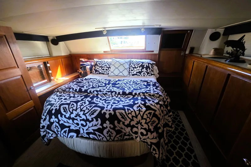 Slide: The Image of Luxurious bedroom interior of 1990 Californian 48 Cockpit Motor Yacht with elegant bedding. - 34
