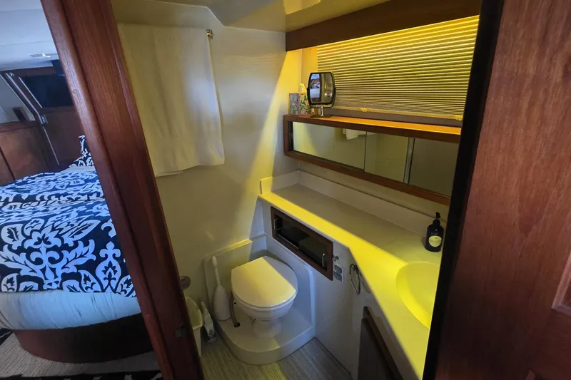 Slide: The Image of Bathroom interior of 1990 Californian 48 Cockpit Motor Yacht with modern amenities. - 36