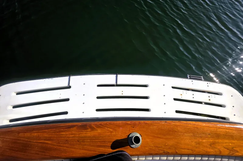 Slide: The Image of 1990 Californian 48 Cockpit Motor Yacht swim platform over water. - 41