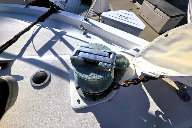Slide: The Image of Anchor winch on 1990 Californian 48 Cockpit Motor Yacht deck, with chain and cover. - 43