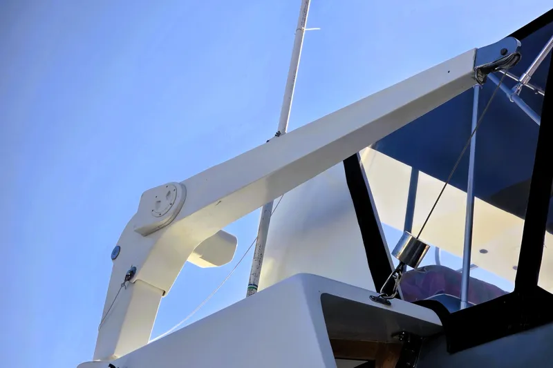 Slide: The Image of 1990 Californian 48 Cockpit Motor Yacht, detailed view of upper structure against clear sky. - 45