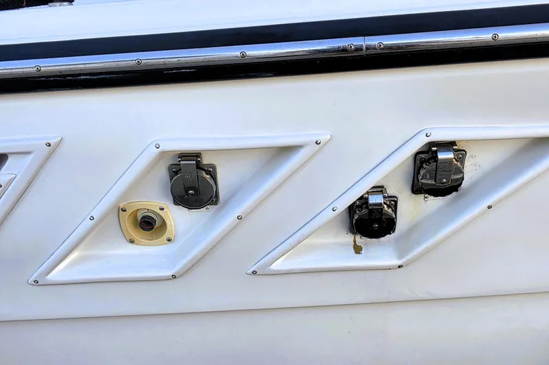 Slide: The Image of Close-up of 1990 Californian 48 Cockpit Motor Yacht's utility connections on the hull. - 46
