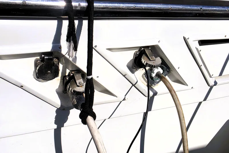 Slide: The Image of 1990 Californian 48 Cockpit Motor Yacht power connections and cables on deck. - 47