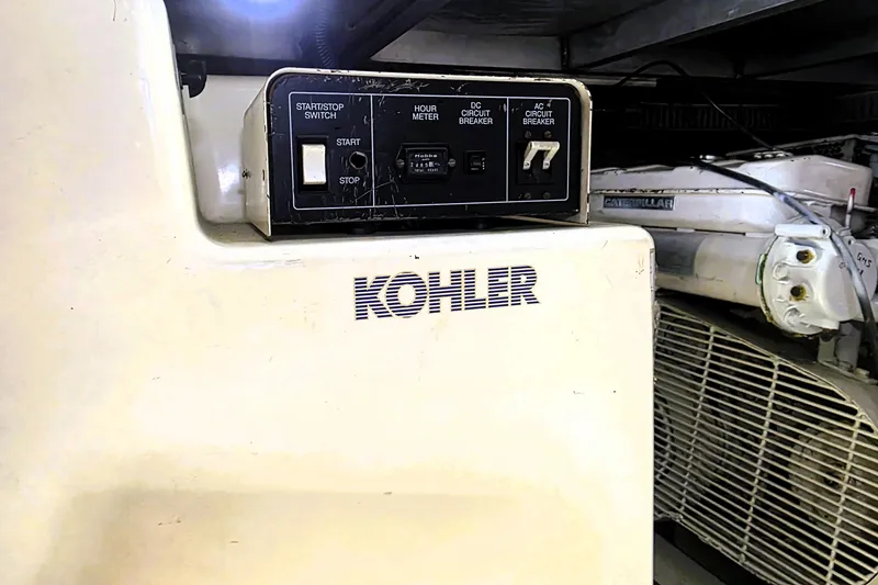 Slide: The Image of Kohler generator control panel on 1990 Californian 48 Cockpit Motor Yacht. - 50