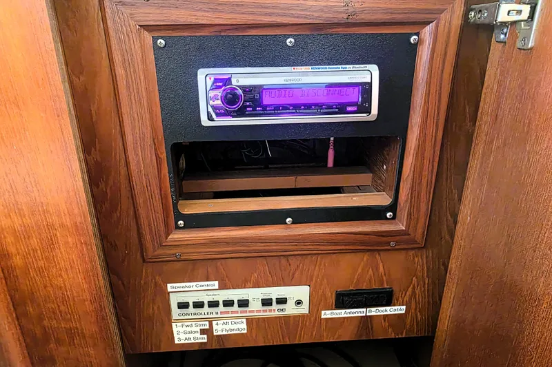 Slide: The Image of Audio system and speaker controls on a 1990 Californian 48 Cockpit Motor Yacht. - 54