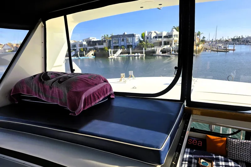 Slide: The Image of Interior view of 1990 Californian 48 Cockpit Motor Yacht overlooking marina. - 7