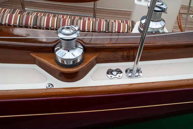 Slide: The Image of Close-up of a 2011 Morris M42 yacht deck with polished wood and chrome details. - 15