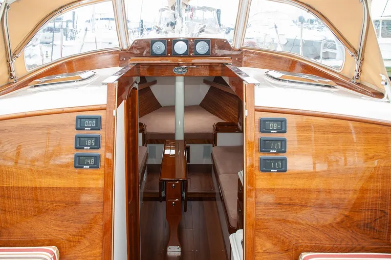 Slide: The Image of Interior view of 2011 Morris M42 sailboat with polished wood finish and navigation instruments. - 16