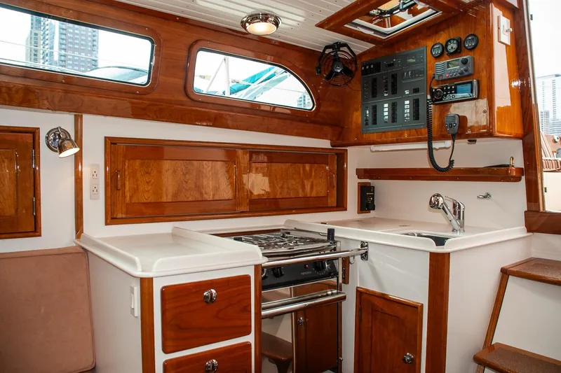 Slide: The Image of Luxurious 2011 Morris M42 yacht interior with wood cabinetry and modern kitchen amenities. - 25