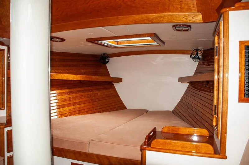 Slide: The Image of Luxurious interior of 2011 Morris M42 yacht with wooden finishes and cozy sleeping area. - 26