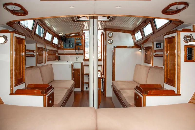 Slide: The Image of Luxurious interior of a 2011 Morris M42 sailboat with elegant wood finishes. - 28