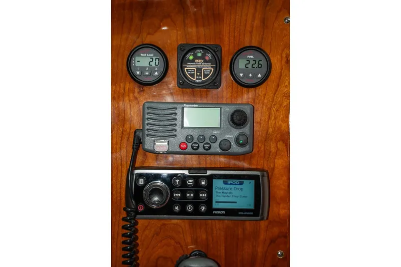 Slide: The Image of Control panel of a 2011 Morris M42 yacht with gauges and radio equipment. - 34