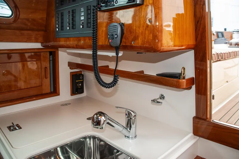 Slide: The Image of Interior of a 2011 Morris M42 yacht featuring a sleek sink and wooden cabinetry. - 35