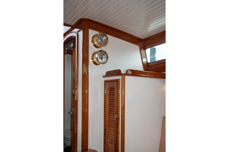 Slide: The Image of Interior of 2011 Morris M42 yacht with wooden trim and nautical instruments. - 36