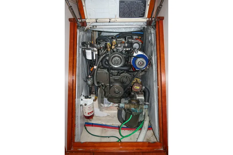 Slide: The Image of Engine compartment of a 2011 Morris M42, showcasing detailed mechanical components. - 37