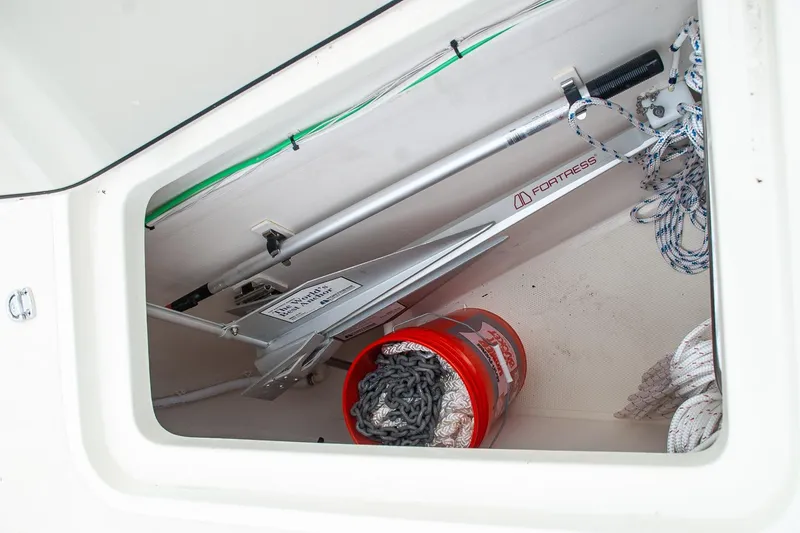 Slide: The Image of Storage compartment of a 2011 Morris M42 sailboat with anchor and ropes. - 6