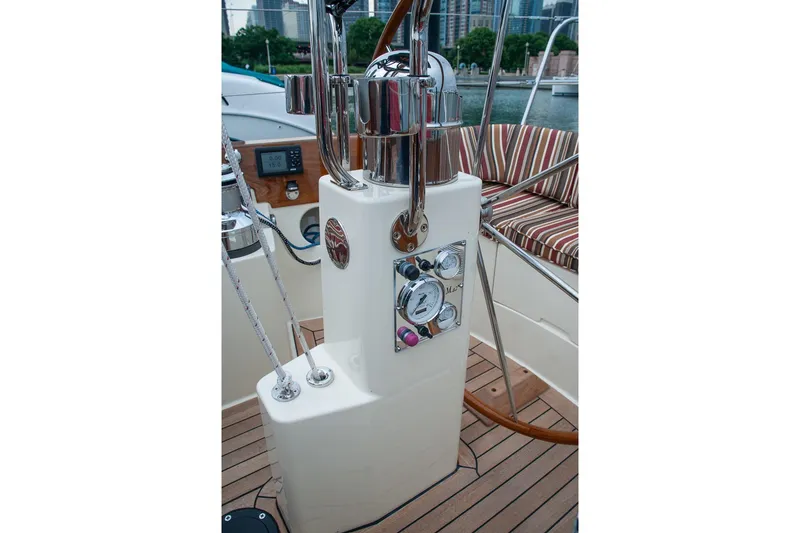Slide: The Image of Cockpit of 2011 Morris M42 sailboat with steering wheel and control panel. - 9