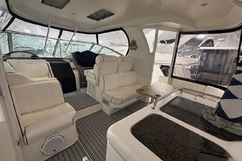 Slide: The Image of Luxurious interior of 2005 Cruisers Yachts 405 Express Motoryacht with plush seating and helm. - 12