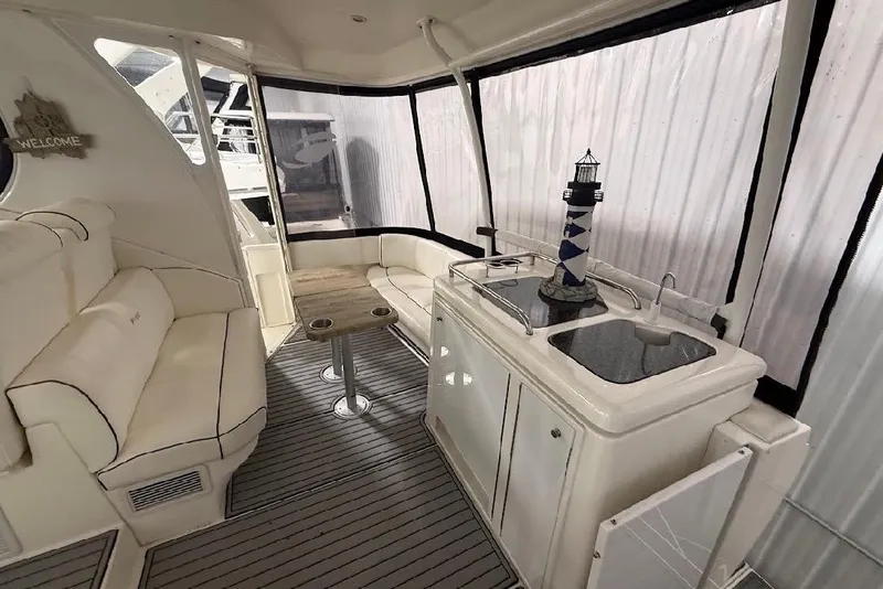 Slide: The Image of Luxurious interior of 2005 Cruisers Yachts 405 Express Motoryacht with seating and kitchenette. - 13
