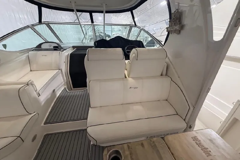 Slide: The Image of 2005 Cruisers Yachts 405 Express Motoryacht interior with white seating and helm. - 17