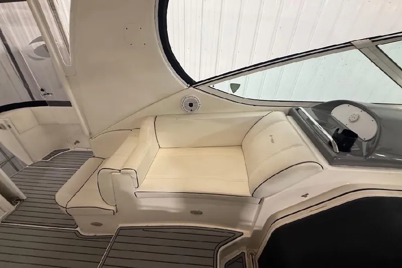 Slide: The Image of 2005 Cruisers Yachts 405 Express Motoryacht interior with beige seating and sleek design. - 18