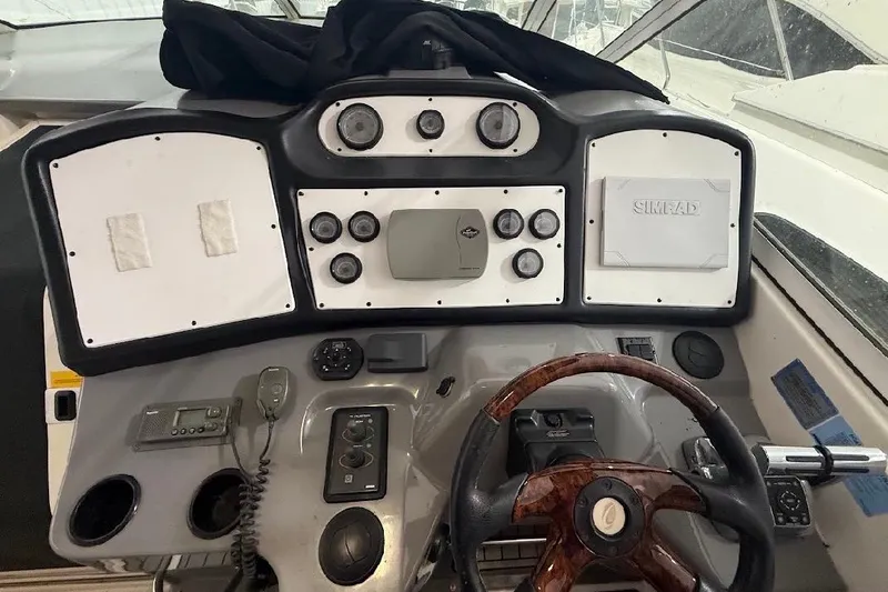 Slide: The Image of Helm of 2005 Cruisers Yachts 405 Express Motoryacht with steering wheel and navigation controls. - 20