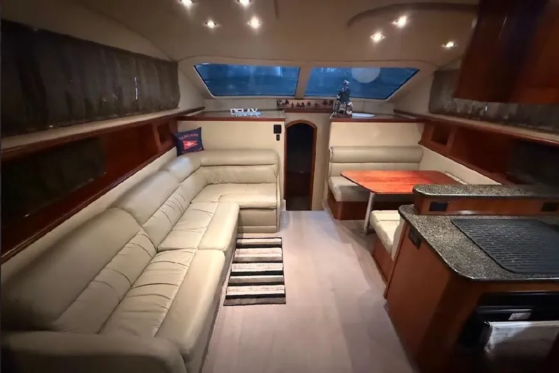 Slide: The Image of Luxurious interior of 2005 Cruisers Yachts 405 Express Motoryacht with plush seating and dining area. - 23