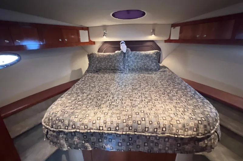 Slide: The Image of Luxurious bedroom in 2005 Cruisers Yachts 405 Express Motoryacht with elegant bedding. - 33