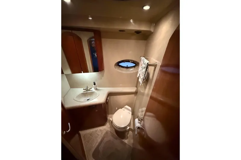 Slide: The Image of Luxurious bathroom in 2005 Cruisers Yachts 405 Express Motoryacht with sink and toilet. - 37
