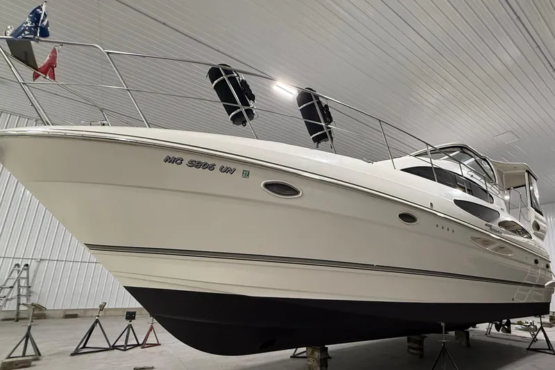 Slide: The Image of 2005 Cruisers Yachts 405 Express Motoryacht in indoor storage, side view. - 4