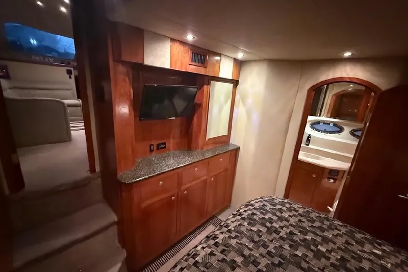 Slide: The Image of Luxurious interior of 2005 Cruisers Yachts 405 Express Motoryacht with TV and wood cabinetry. - 45