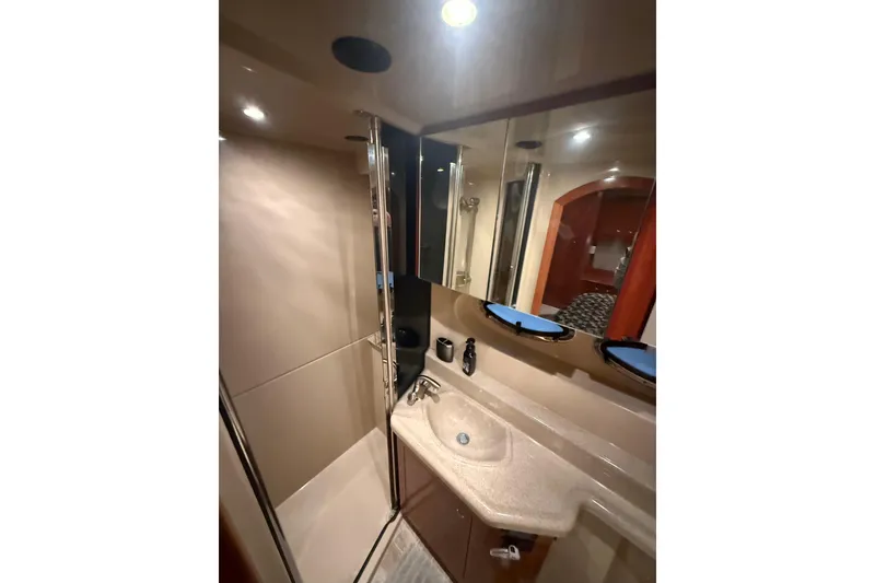 Slide: The Image of Luxurious bathroom in 2005 Cruisers Yachts 405 Express Motoryacht with modern fixtures and lighting. - 49