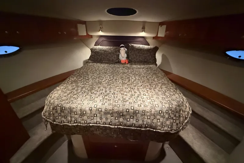 Slide: The Image of Luxurious bedroom in 2005 Cruisers Yachts 405 Express Motoryacht with plush bedding. - 51