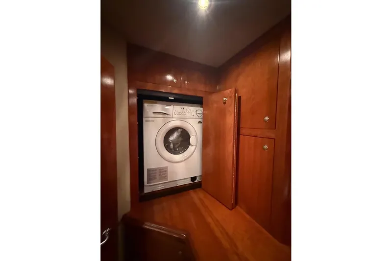 Slide: The Image of Laundry area with washer in 2005 Cruisers Yachts 405 Express Motoryacht. - 58