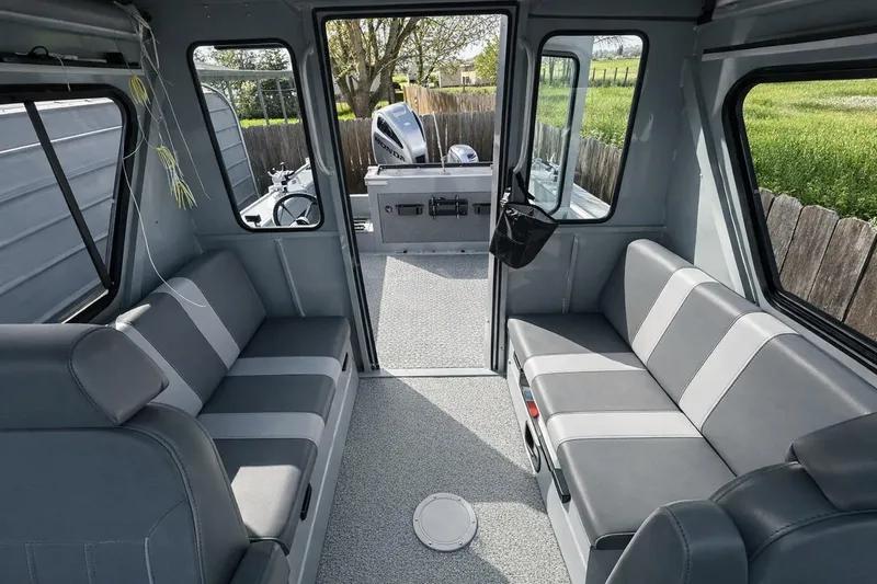 Slide: The Image of Interior of 2022 Hewescraft 220 Ocean Pro ET Hardtop with gray seating and spacious layout. - 11