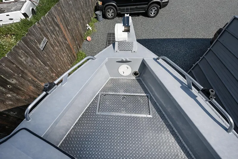 Slide: The Image of 2022 Hewescraft 220 Ocean Pro ET Hardtop boat deck with diamond plate flooring. - 24