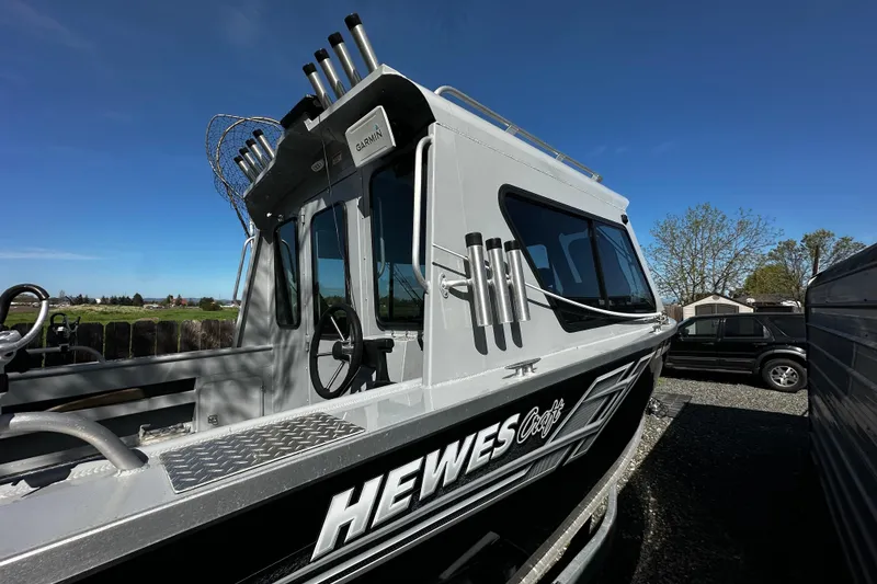 Slide: The Image of 2022 Hewescraft 220 Ocean Pro ET Hardtop boat with hardtop and fishing rod holders. - 3