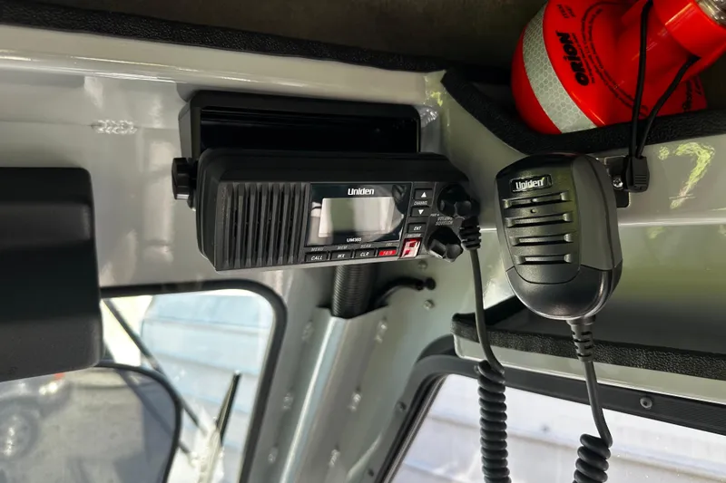 Slide: The Image of Uniden marine radio inside 2022 Hewescraft 220 Ocean Pro ET Hardtop boat. - 9