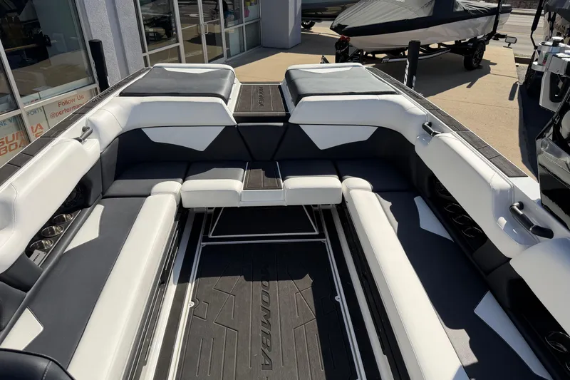 Slide: The Image of 2025 Moomba Makai boat interior with sleek white and gray seating design. - 16